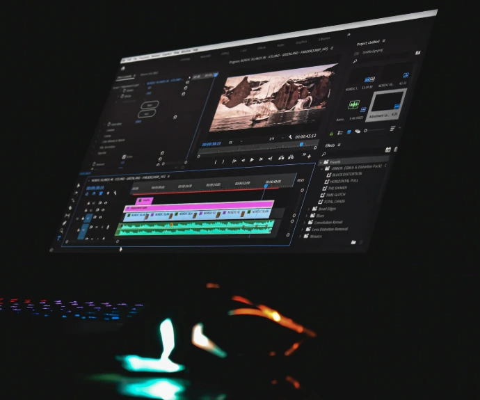 black laptop computer turned on displaying music player